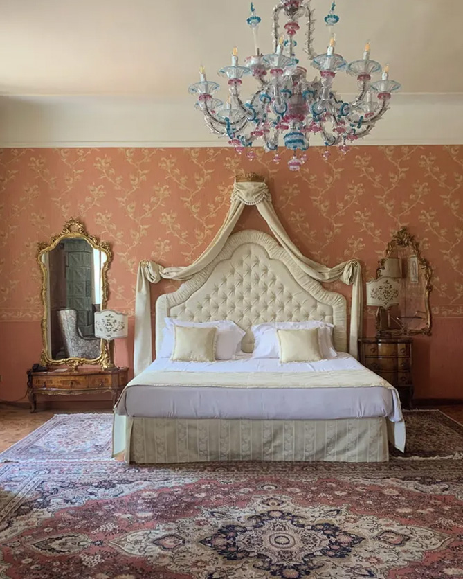 An elegant bedroom at Castello di Spessa